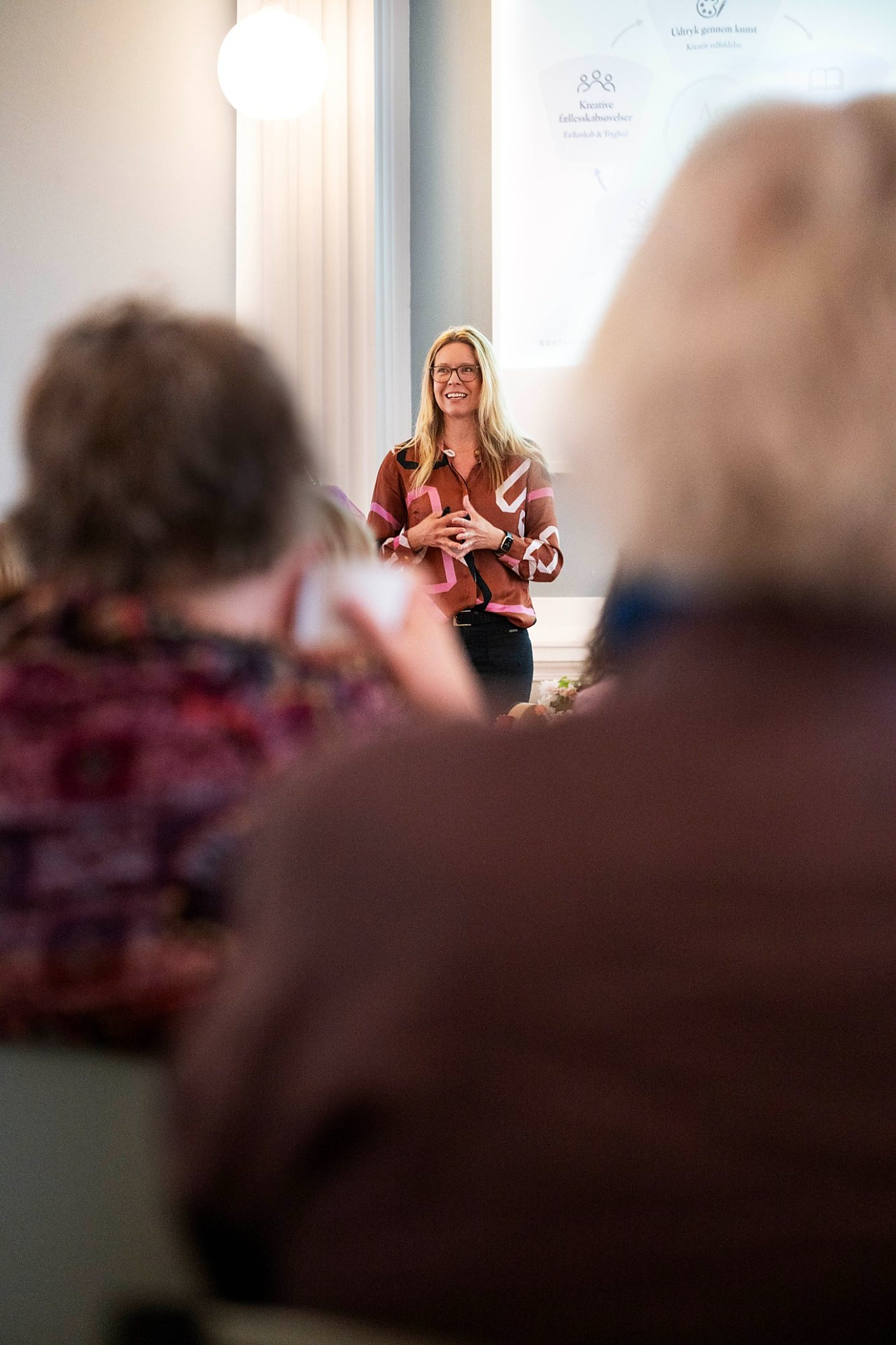 Loa Brix teaching in front of a group